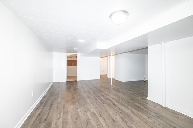 unfurnished room with hardwood / wood-style flooring