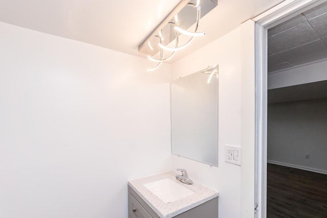 bathroom with hardwood / wood-style floors and vanity