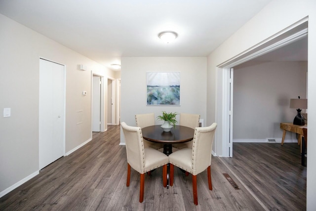 dining room featuring dark wood-type flooring