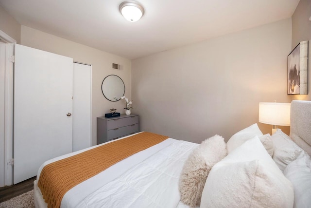 bedroom with a closet and wood-type flooring