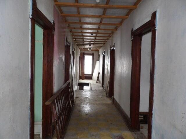 hallway with concrete flooring