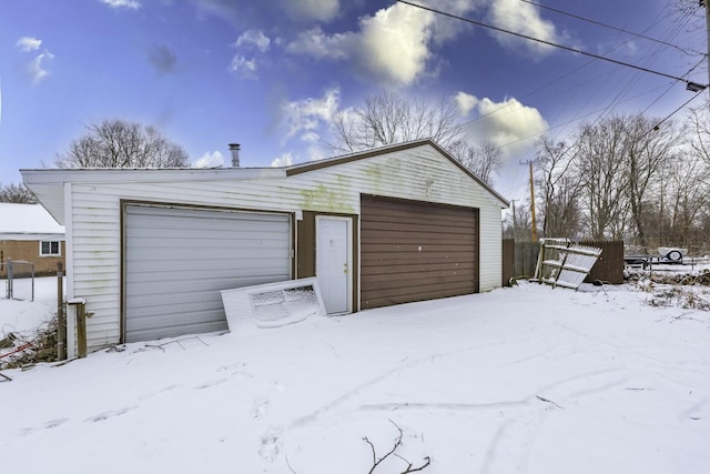 view of snow covered garage