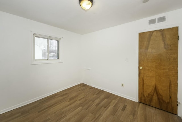 empty room featuring dark hardwood / wood-style floors