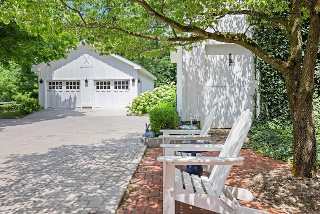 exterior space featuring an outbuilding and a garage