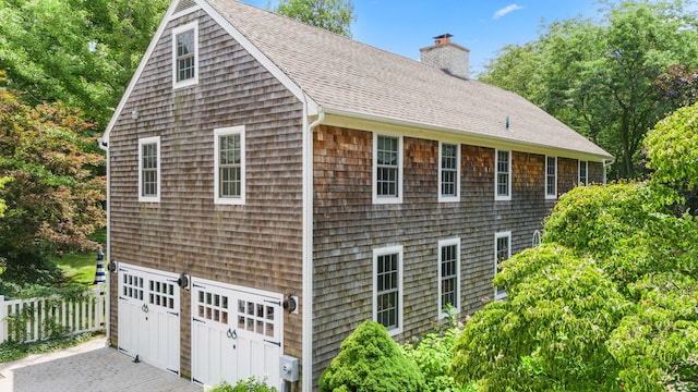 view of property exterior featuring a garage