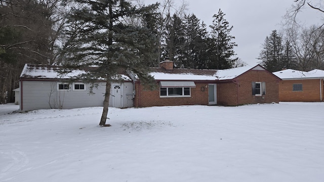 view of snow covered house