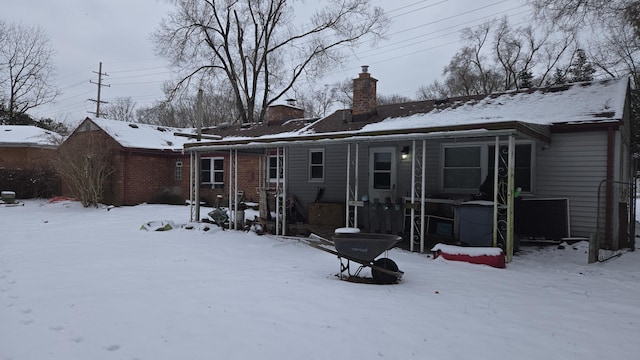 view of snow covered house