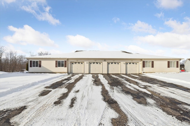 ranch-style home featuring a garage