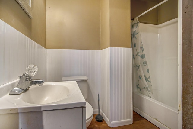 full bathroom with toilet, sink, shower / bath combination with curtain, and hardwood / wood-style flooring