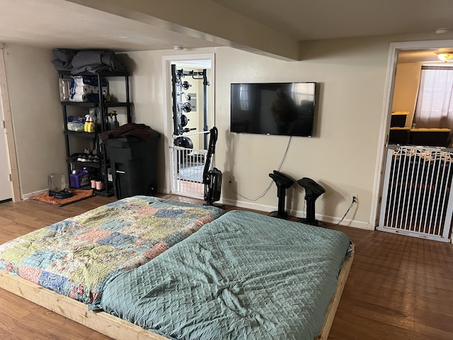 bedroom with hardwood / wood-style floors