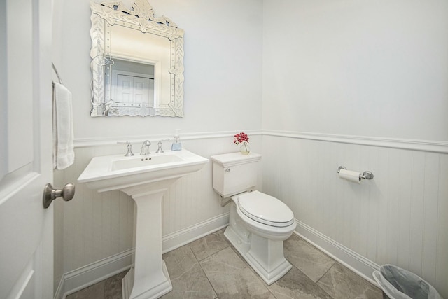 bathroom with tile patterned floors and toilet