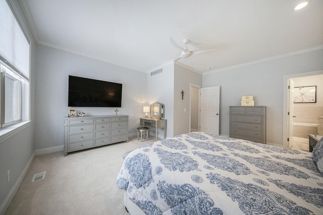 bedroom with ceiling fan, ensuite bathroom, light colored carpet, and ornamental molding