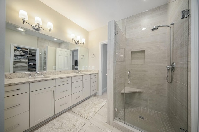 bathroom featuring vanity, tile patterned floors, and walk in shower