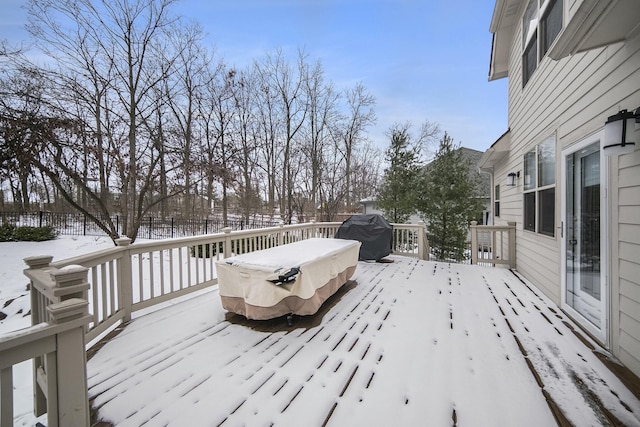 snow covered deck featuring grilling area