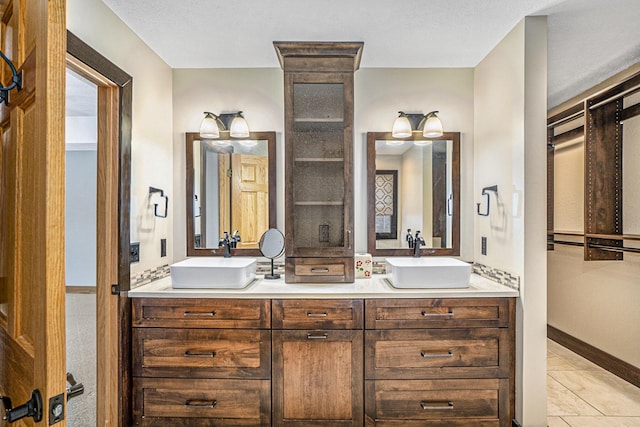 bathroom featuring tile patterned floors and vanity