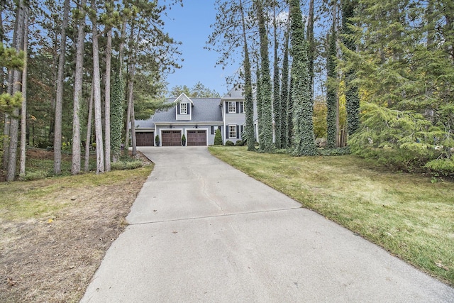 cape cod-style house with a front yard and a garage