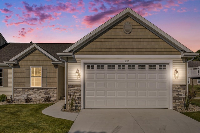 view of front of house with a lawn and a garage