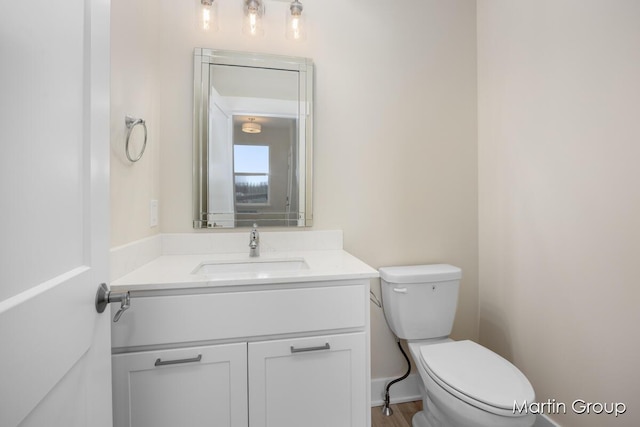 bathroom with vanity and toilet