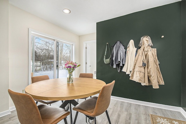 dining area with hardwood / wood-style flooring