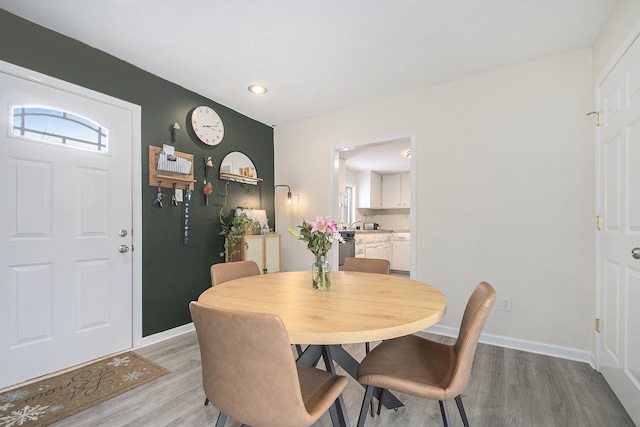 dining space with light wood-type flooring