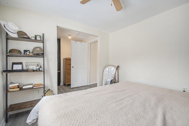 bedroom with ceiling fan and hardwood / wood-style floors