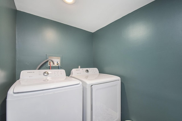 laundry area with independent washer and dryer