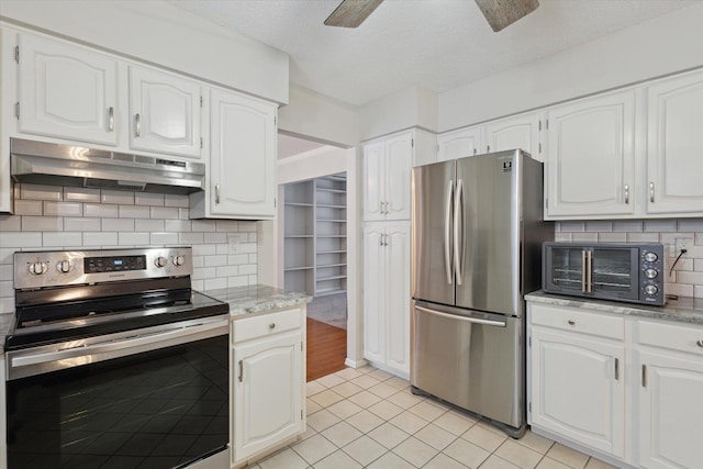 kitchen featuring white cabinetry, decorative backsplash, appliances with stainless steel finishes, and ceiling fan