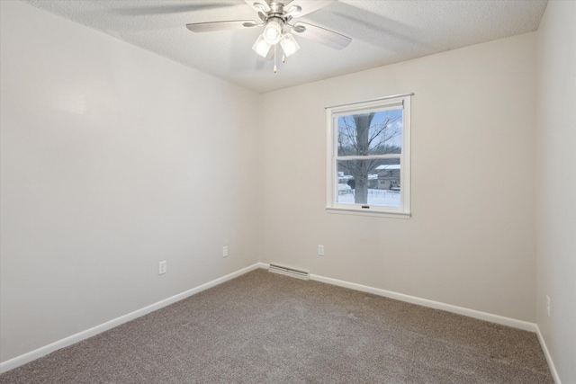 spare room featuring carpet, ceiling fan, and a textured ceiling