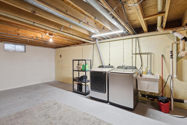 laundry room featuring sink and washer and clothes dryer