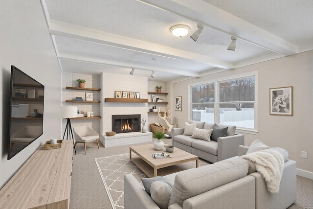 living room featuring carpet flooring, a fireplace, and beam ceiling