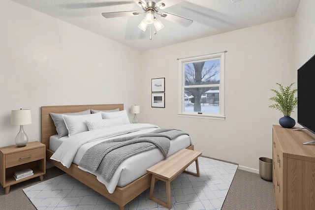 bedroom featuring ceiling fan and light colored carpet