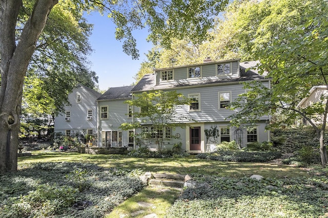 view of front of home with a front yard