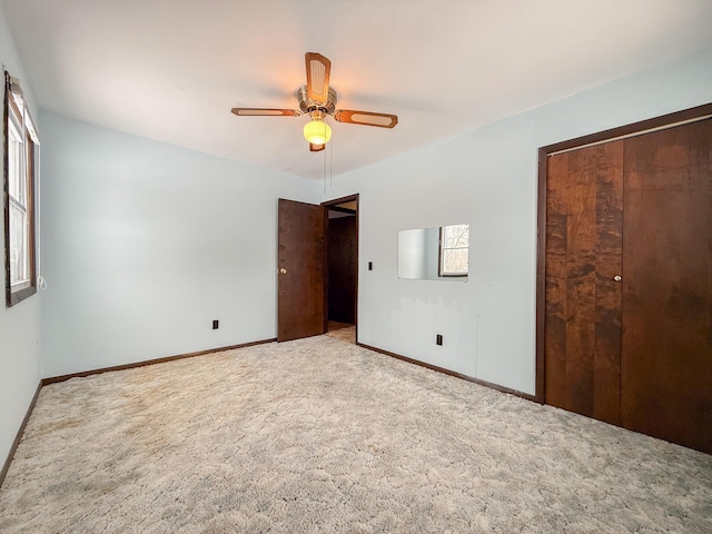 unfurnished bedroom with carpet flooring and ceiling fan