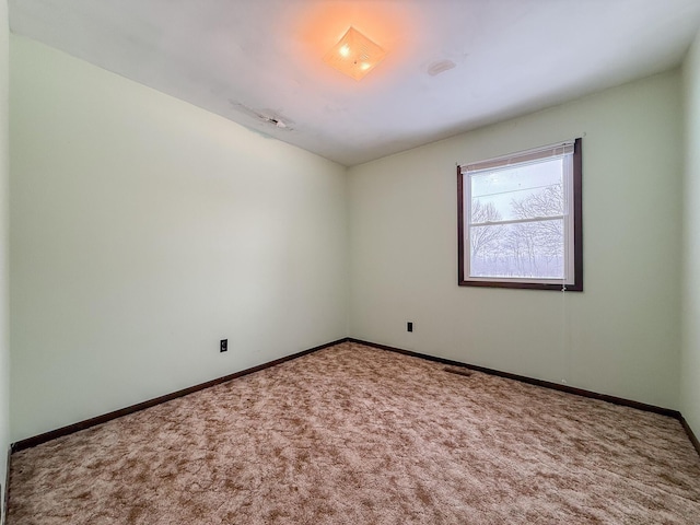 view of carpeted spare room