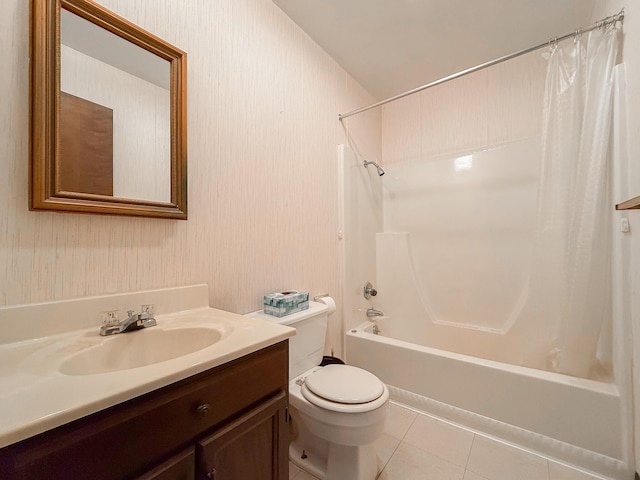 full bathroom featuring tile patterned flooring, vanity, toilet, and shower / bathtub combination with curtain