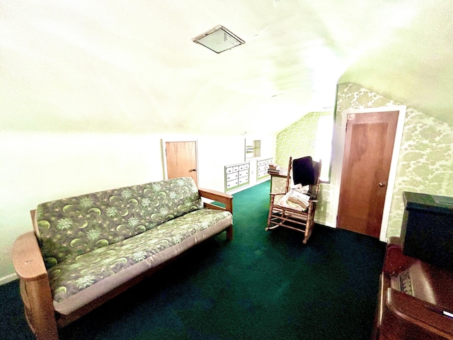 sitting room featuring carpet and lofted ceiling