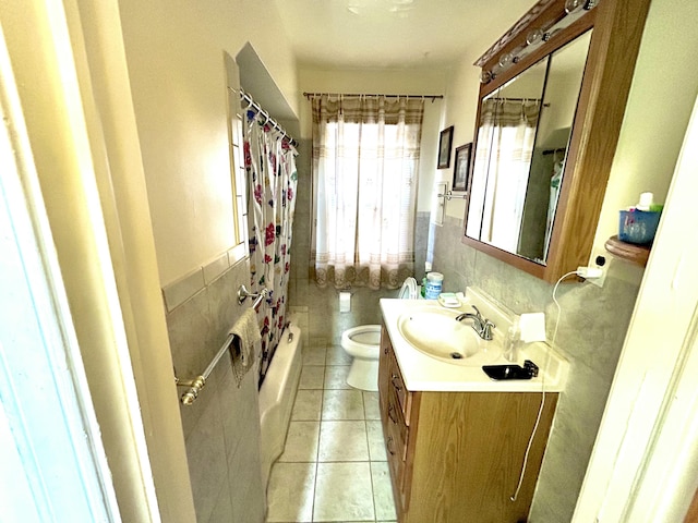 full bathroom featuring tile patterned flooring, vanity, shower / bath combination with curtain, and toilet