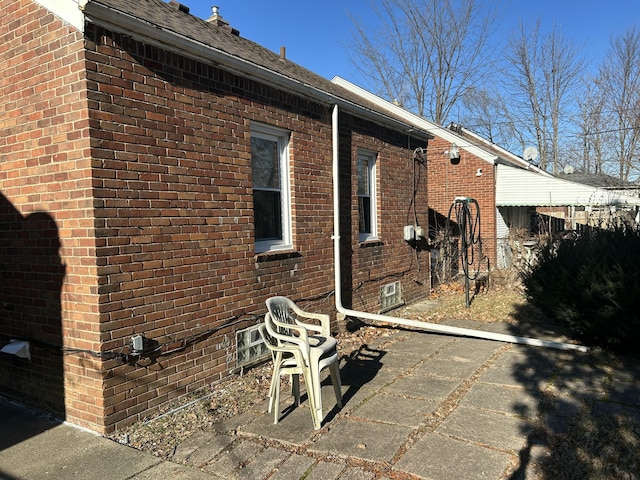 view of property exterior with a patio