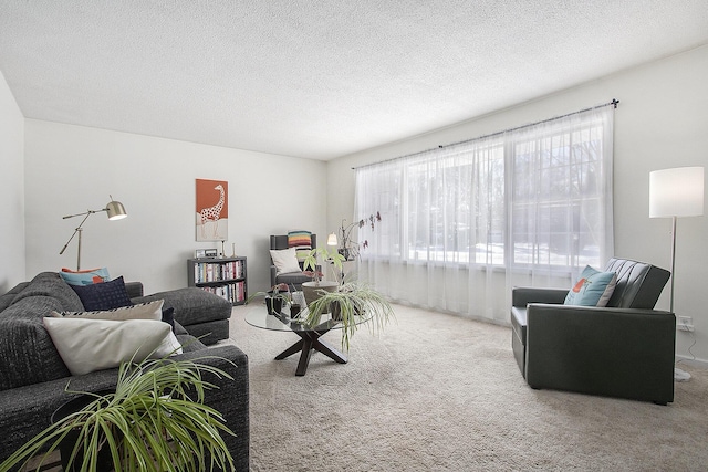 carpeted living room featuring a textured ceiling