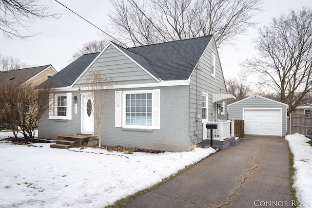 view of front facade featuring a garage and an outdoor structure