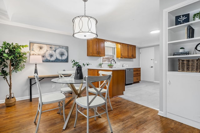 dining space with light hardwood / wood-style flooring