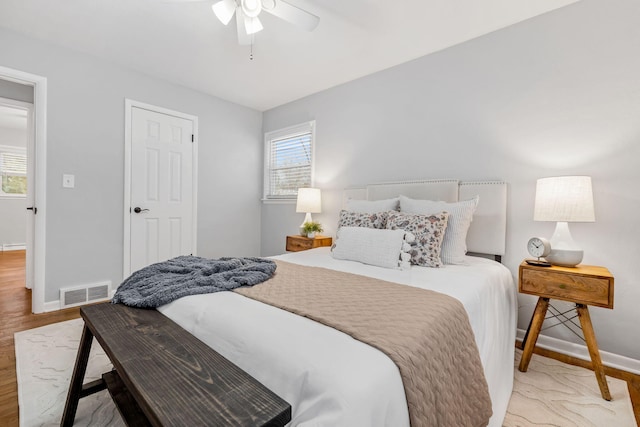 bedroom featuring ceiling fan and light hardwood / wood-style flooring