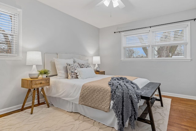 bedroom with ceiling fan and hardwood / wood-style floors