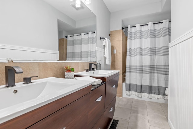 full bathroom featuring toilet, tile patterned flooring, shower / bath combo, and vanity