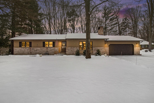 single story home featuring a garage