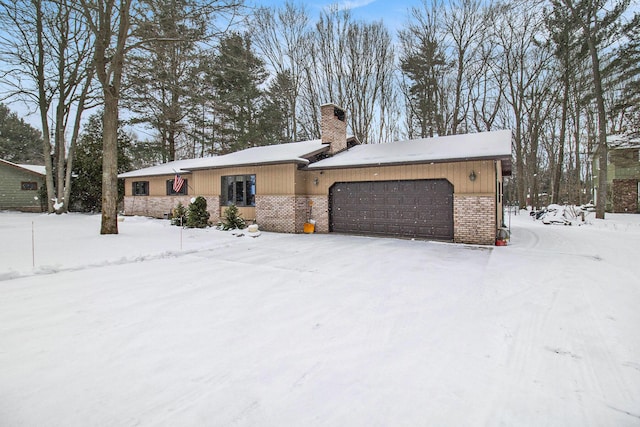 ranch-style home featuring a garage