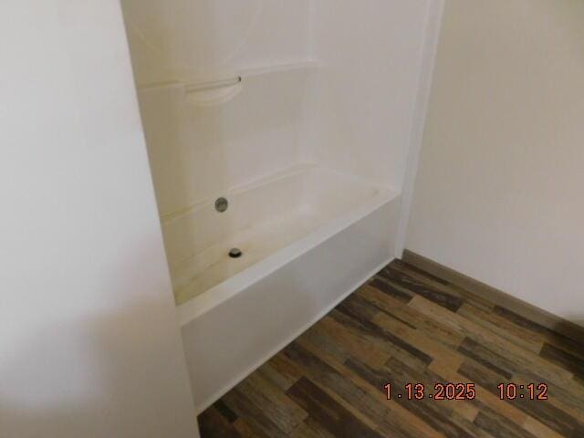 bathroom with hardwood / wood-style flooring