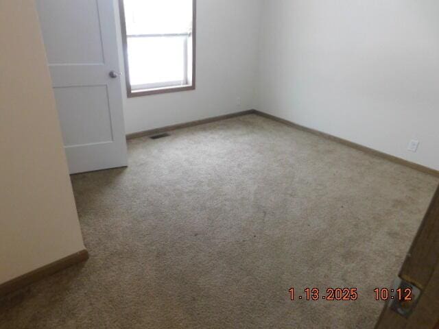 unfurnished room featuring carpet floors