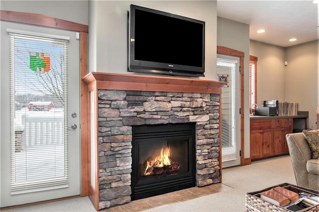 carpeted living room with a fireplace