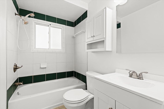 full bathroom with vanity, toilet, and tiled shower / bath